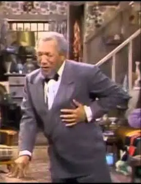 The character Fred Sanford wincing and clutching his chest implying he's having a massive fatal heart attack