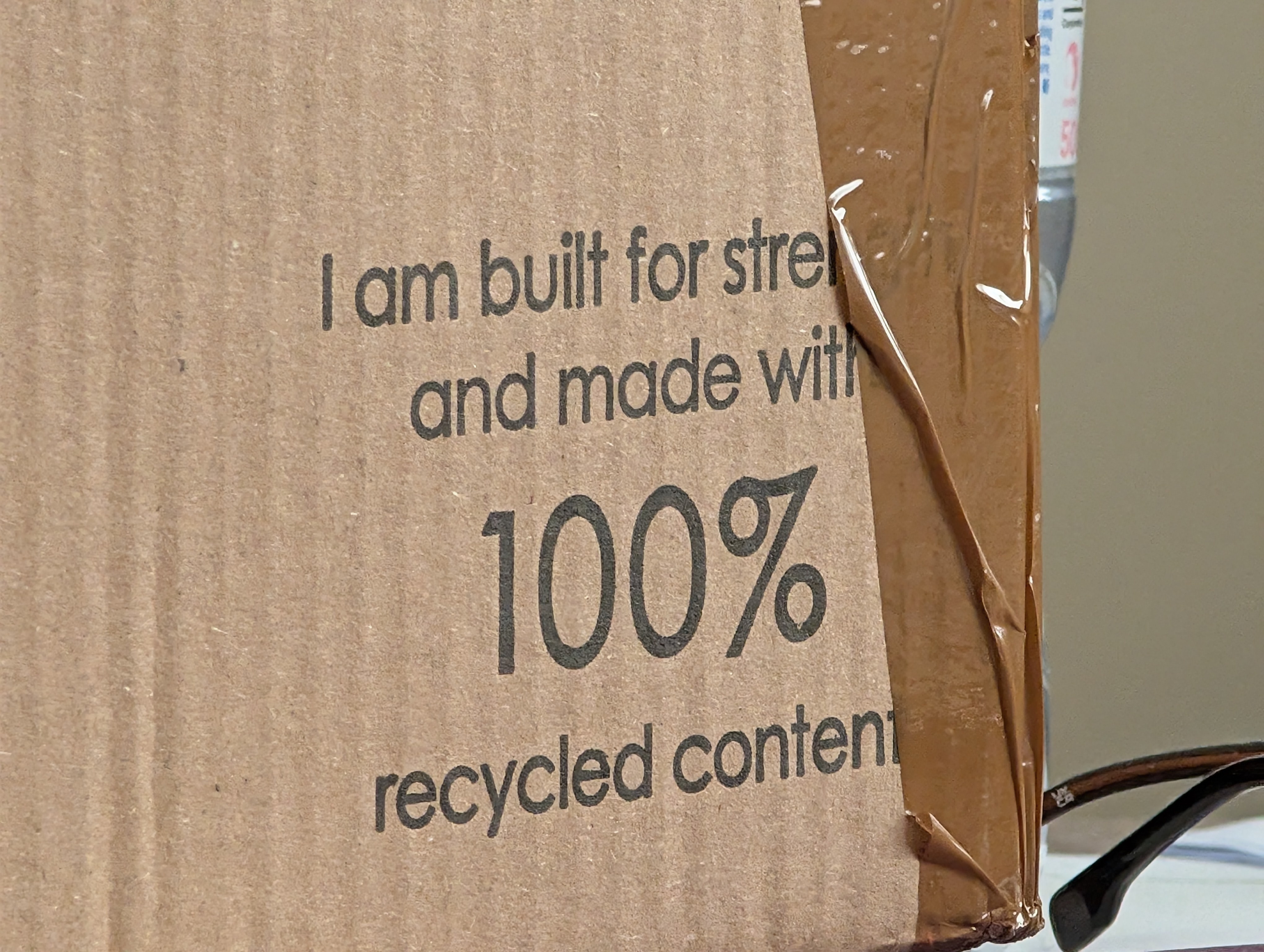 Box with "I am made of 100% recycled content" on it