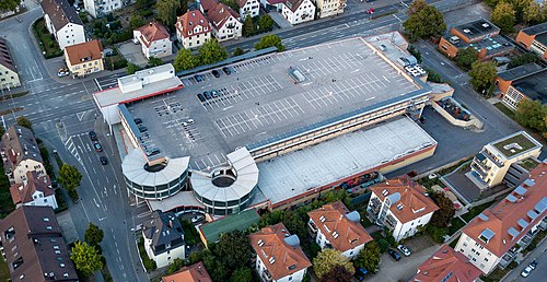 Aerial Photo of a Kaufland in Tübingen, tightly surrounded by residential housing.